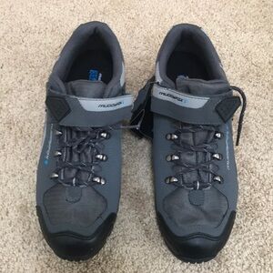 New! Muddyfox tour 200 , men’s SZ  10.5, shoes .